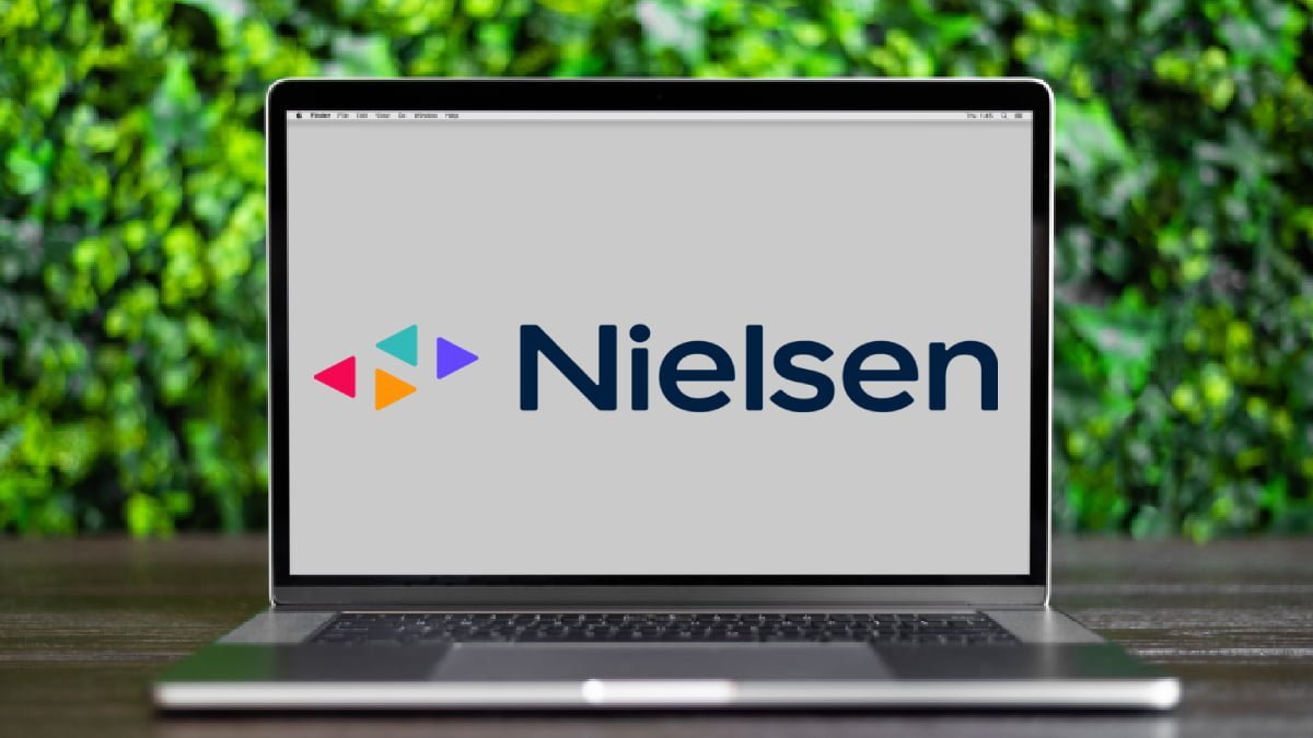 A photo of a laptop displaying the Nielsen logo