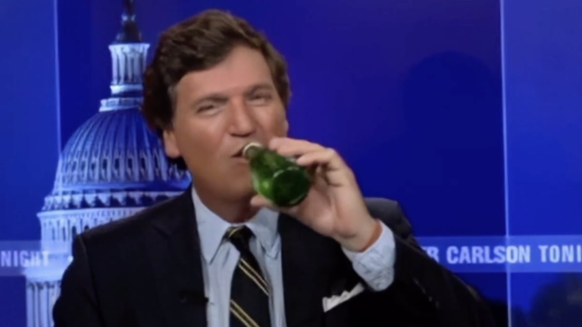 A photo of Tucker Carlson drinking a beer