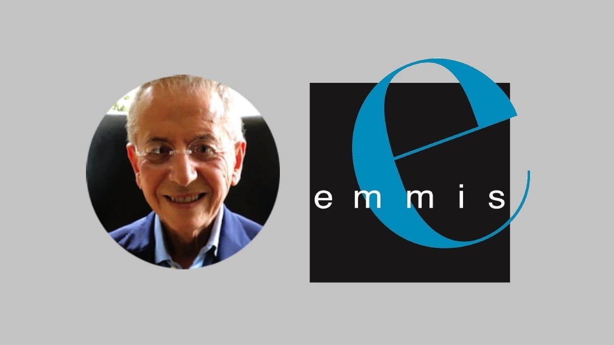 A photo of Rick Cummings and the Emmis logo