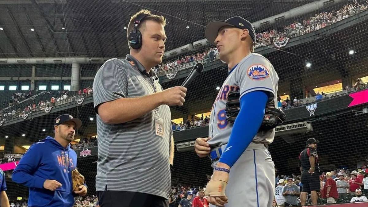 A photo of Pat McCarthy interviewing a New York Met