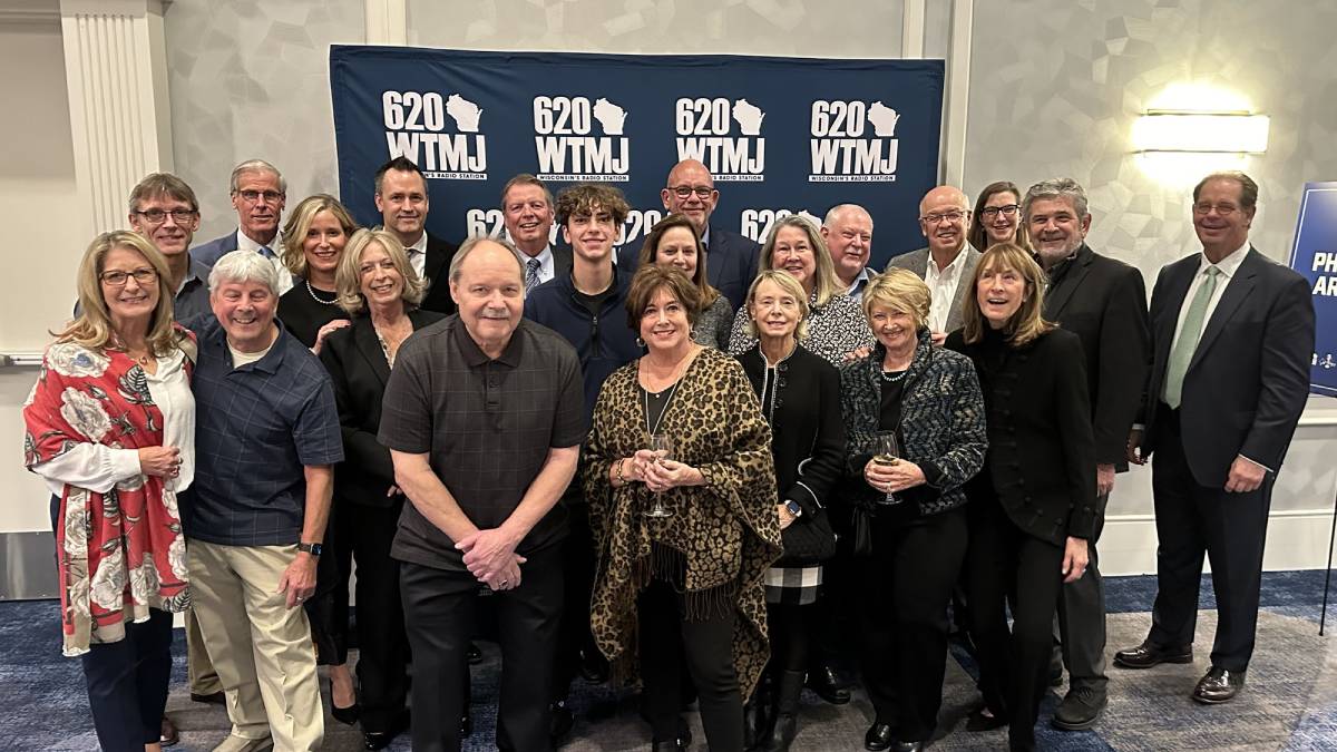 A photo of a group celebrating 620 WTMJ's Jeff Wagner and his retirement.