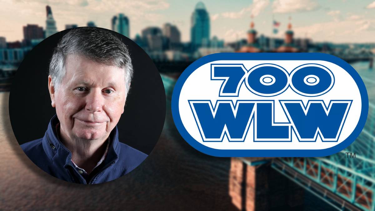 A photo of Bill Cunningham and the 700 WLW logo