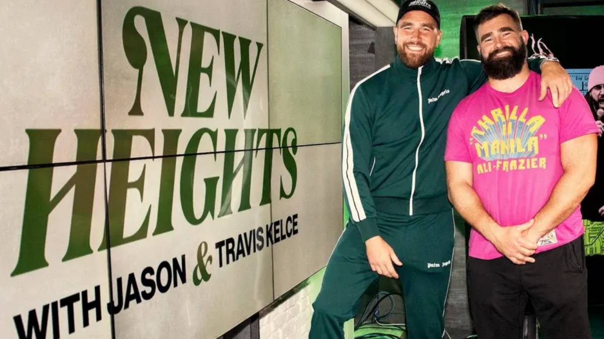 A photo of Jason and Travis Kelce and the New Heights logo