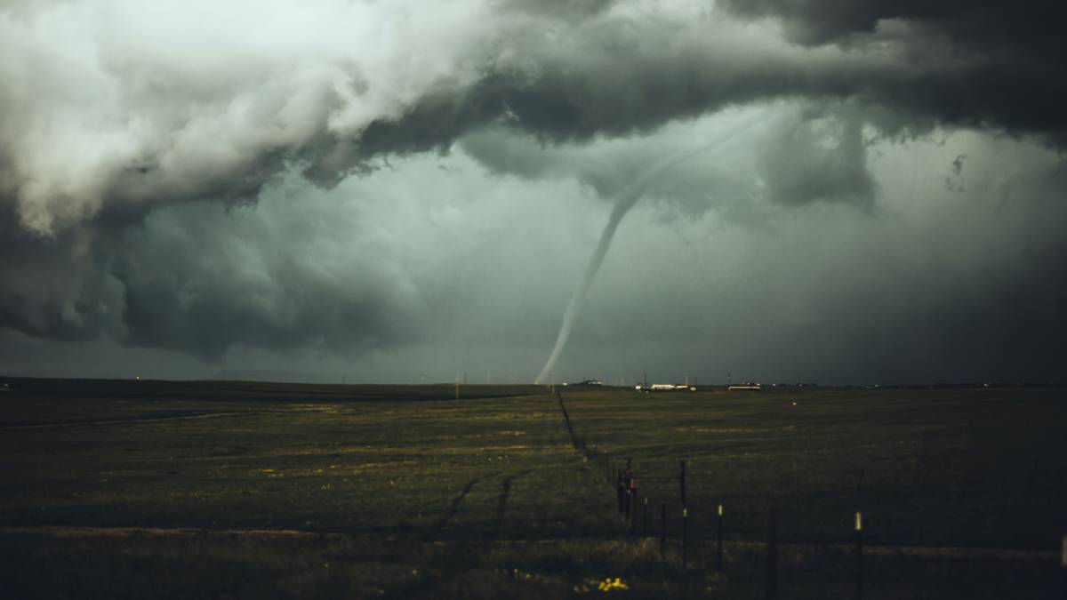 A photo of a tornado on the ground