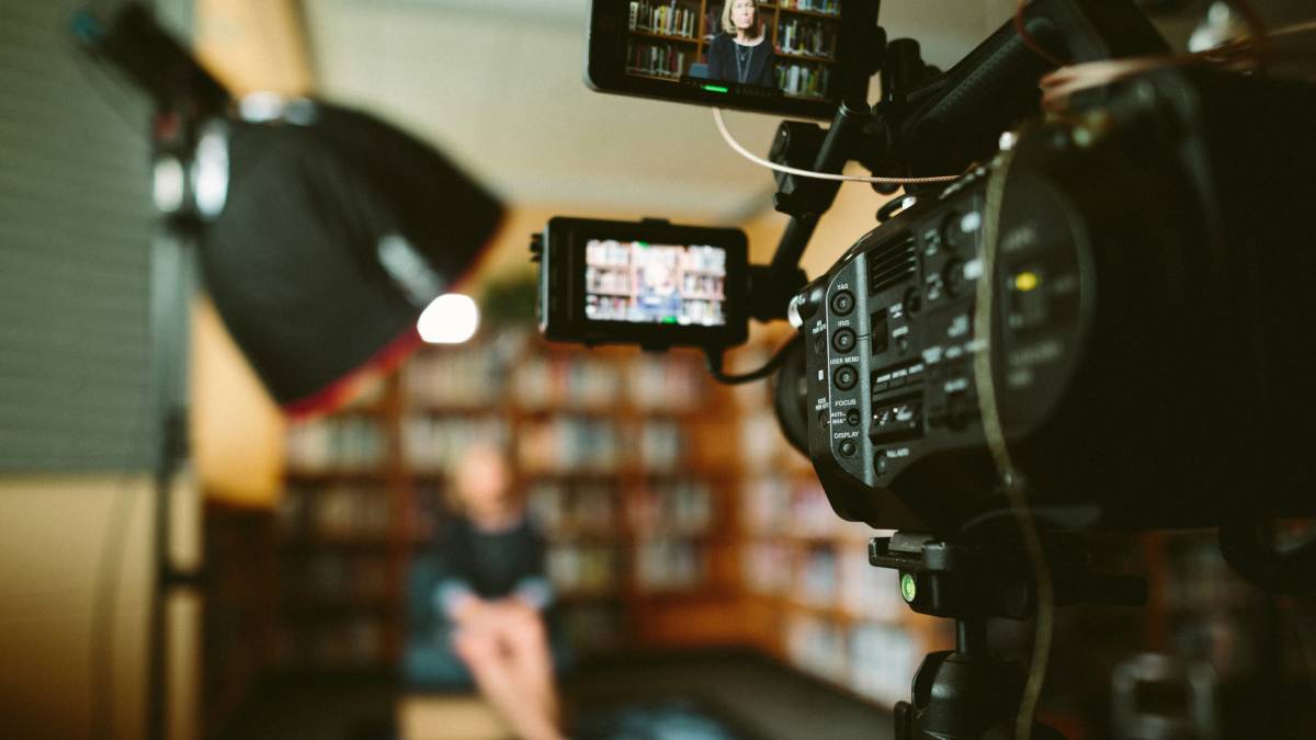 A photo of a TV camera during an interview