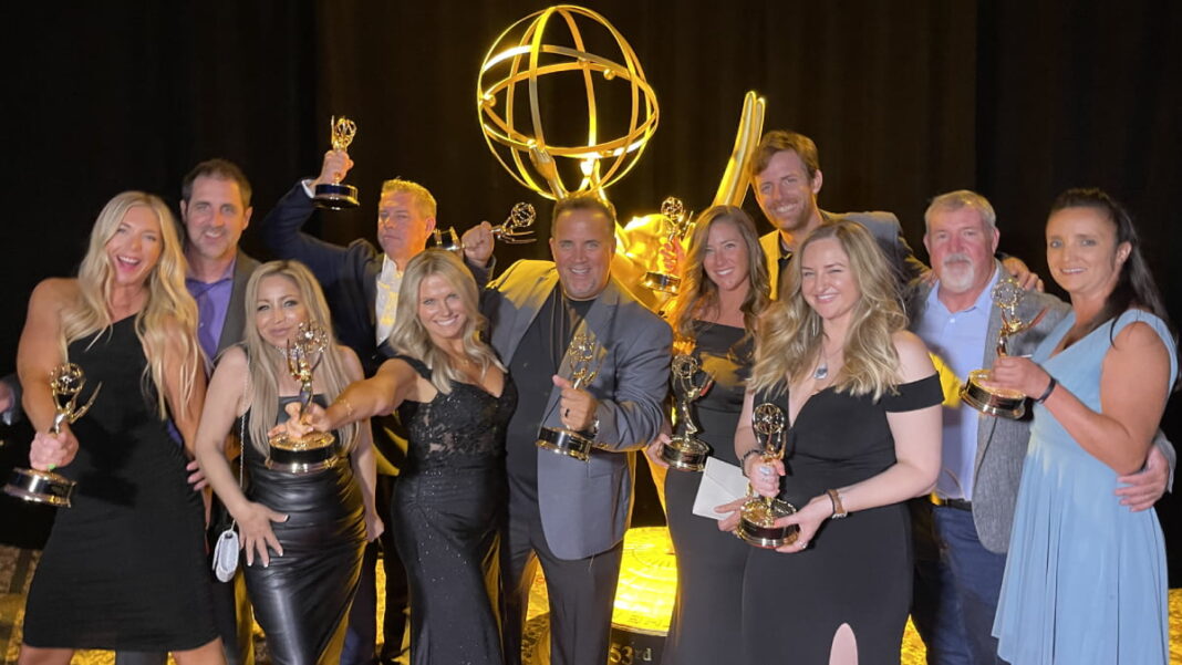 A photo of the KMJ staff accepting a Regional Emmy Award