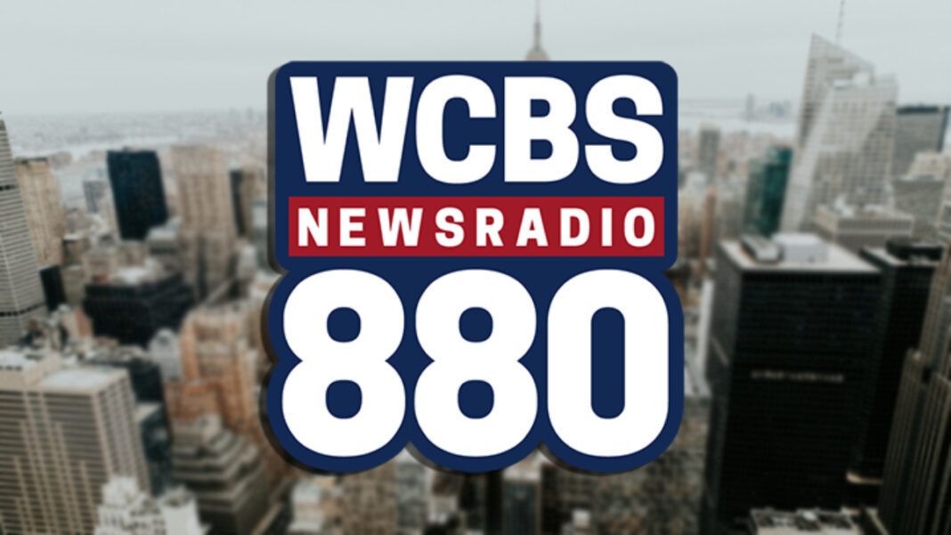 A photo of the WCBS Newsradio 880 logo on the New York skyline