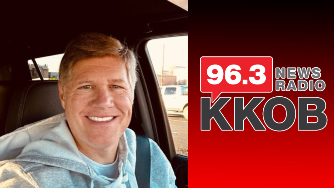 A photo of Darren White and the KKOB logo